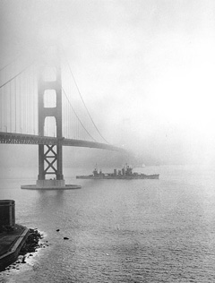 The USS San Francisco passing beneath the Golden Gate Bridge, 1942, California